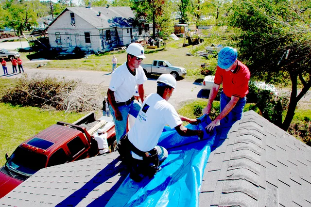 Port Arthur, TX, October 29, 2005 -- Crews attach blue vinyl roofing to a damaged roof. FEMA provides funds for the "blue roof" program. Photo by Ed Edahl/FEMA. What to measure every month in a roofing contractor business for 2027