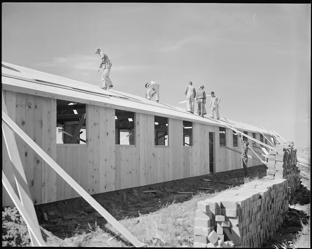Granada Relocation Center, Amache, Colorado. Contractor's workmen roofing the assembled barracks unit. 5 plain facts about roofing contractor license requirements