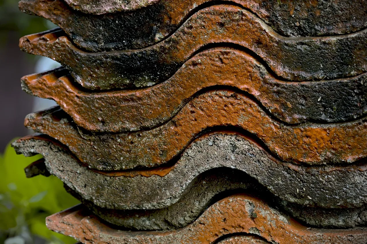 roof tiles, terracotta, clay tiles, ceramic, roofing, tile stack, building material, stacked, burned, texture. Running a roofing contractor business by the rules: licences and compliance