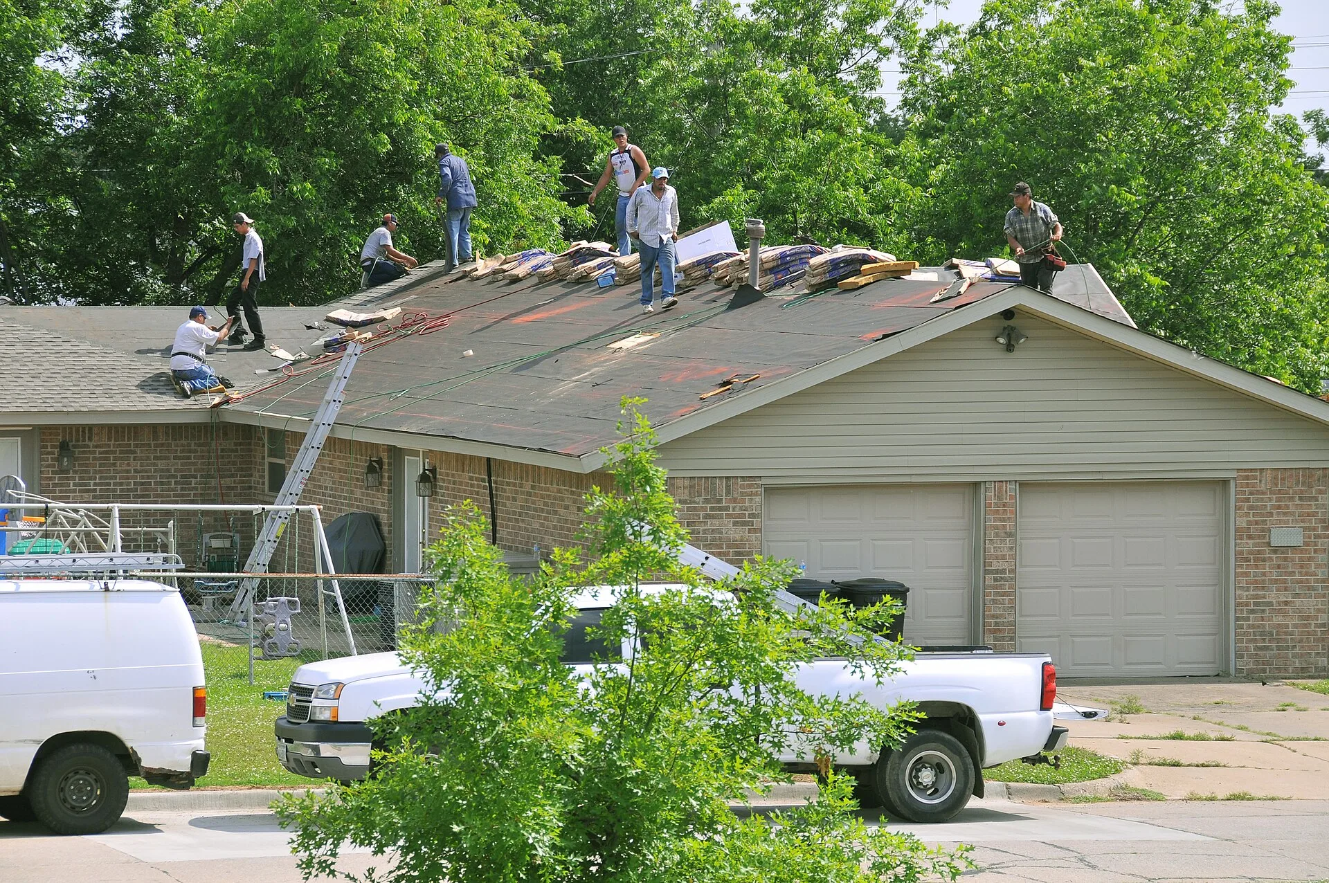Moore, OK, May 26, 2010 -- A roofing crew replaces a roof's shingles on a home with damages from a tornado that struck the area on May 10. Hundreds of homes in the eastern half of the state had damages caused by 22 confirmed tornadoes FEMA Photo by Win Henderson. Roofing contractor profit margin: a break-even method